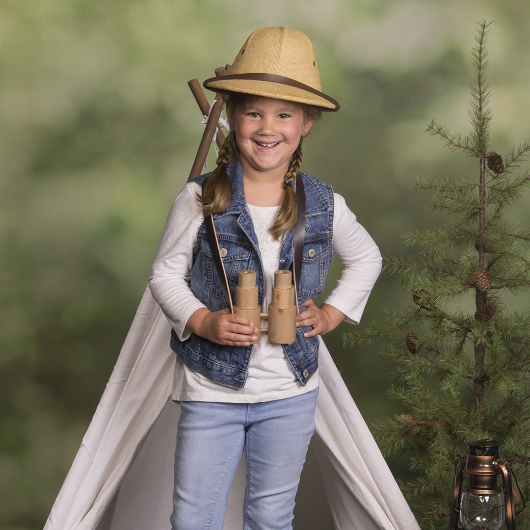 little girl with camping gear