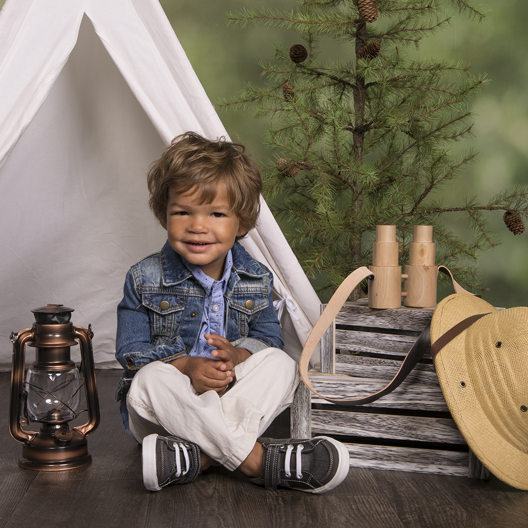 little boy with camping gear